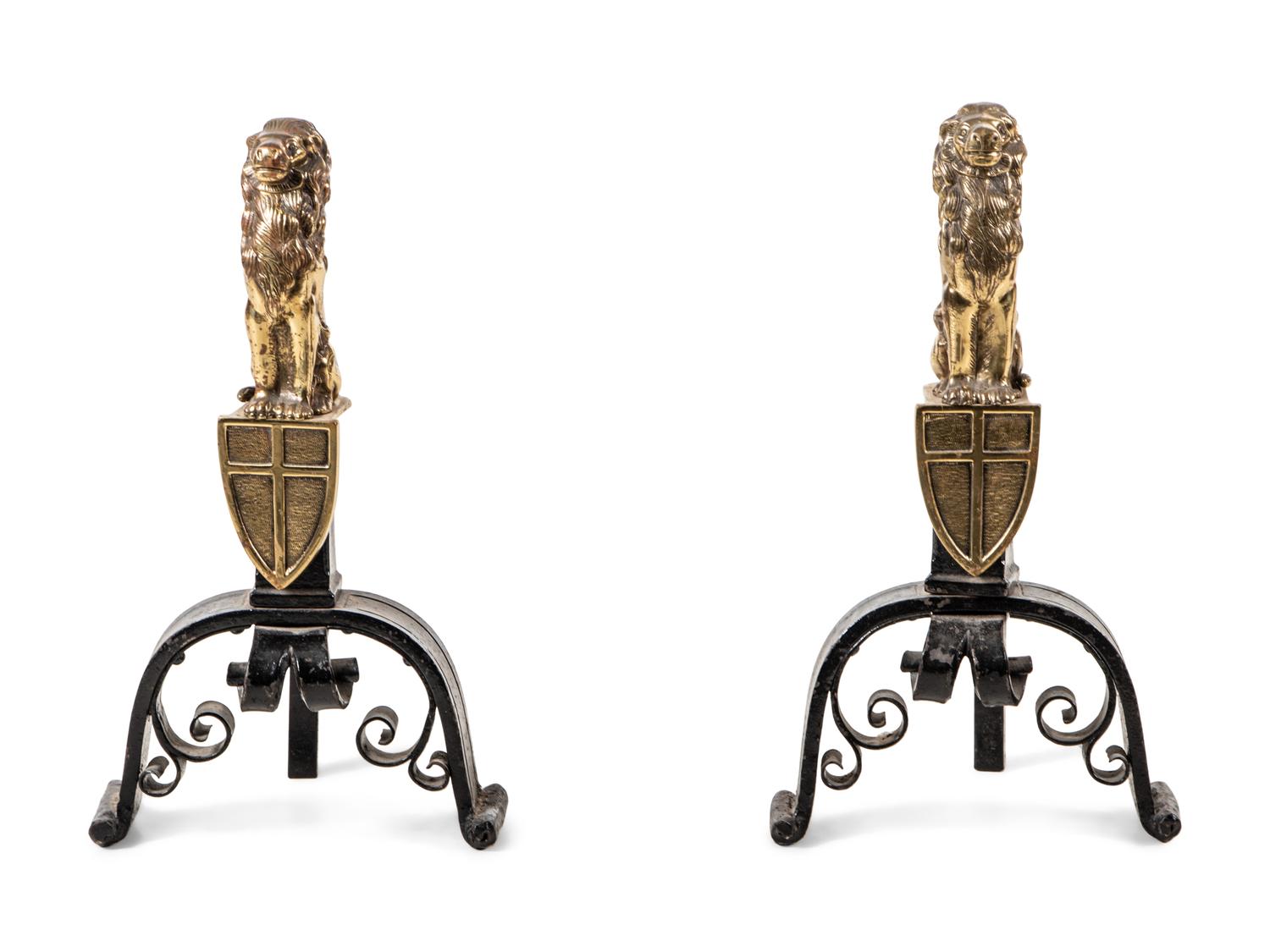 A Pair of English Gilt Brass and Black Painted Iron Andirons with Lion Finials