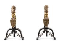 A Pair of English Gilt Brass and Black Painted Iron Andirons with Lion Finials