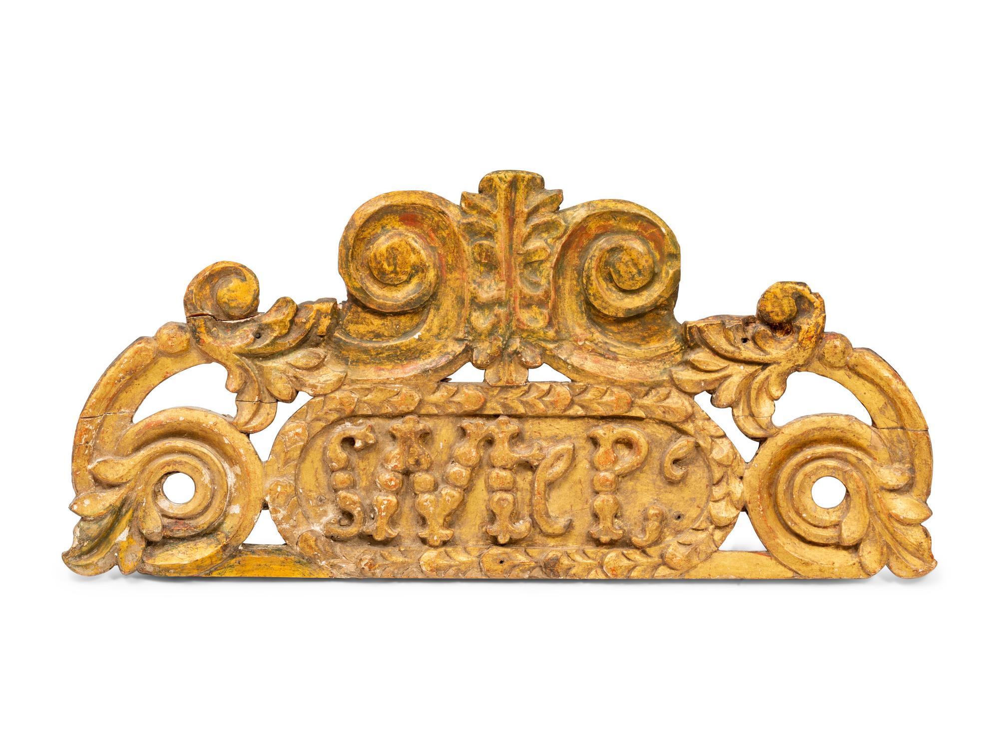 A Spanish Colonial Carved Wooden Plaque