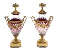 A Pair of Gilt Bronze Mounted Ruby Cut to Clear Glass Covered Urns Height 28 1/2 inches. — 20TH CENTURY