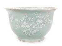 A Chinese White Slip Decorated Celadon Ground Cachepot Diameter 11 1/8 inches.
