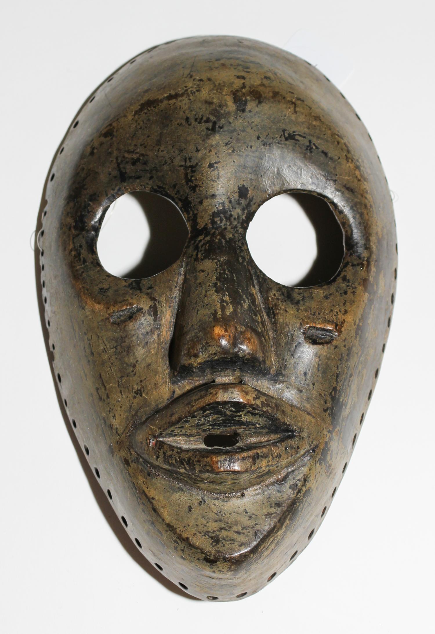 A Dan Wood Mask. Height 8 3/4 inches.