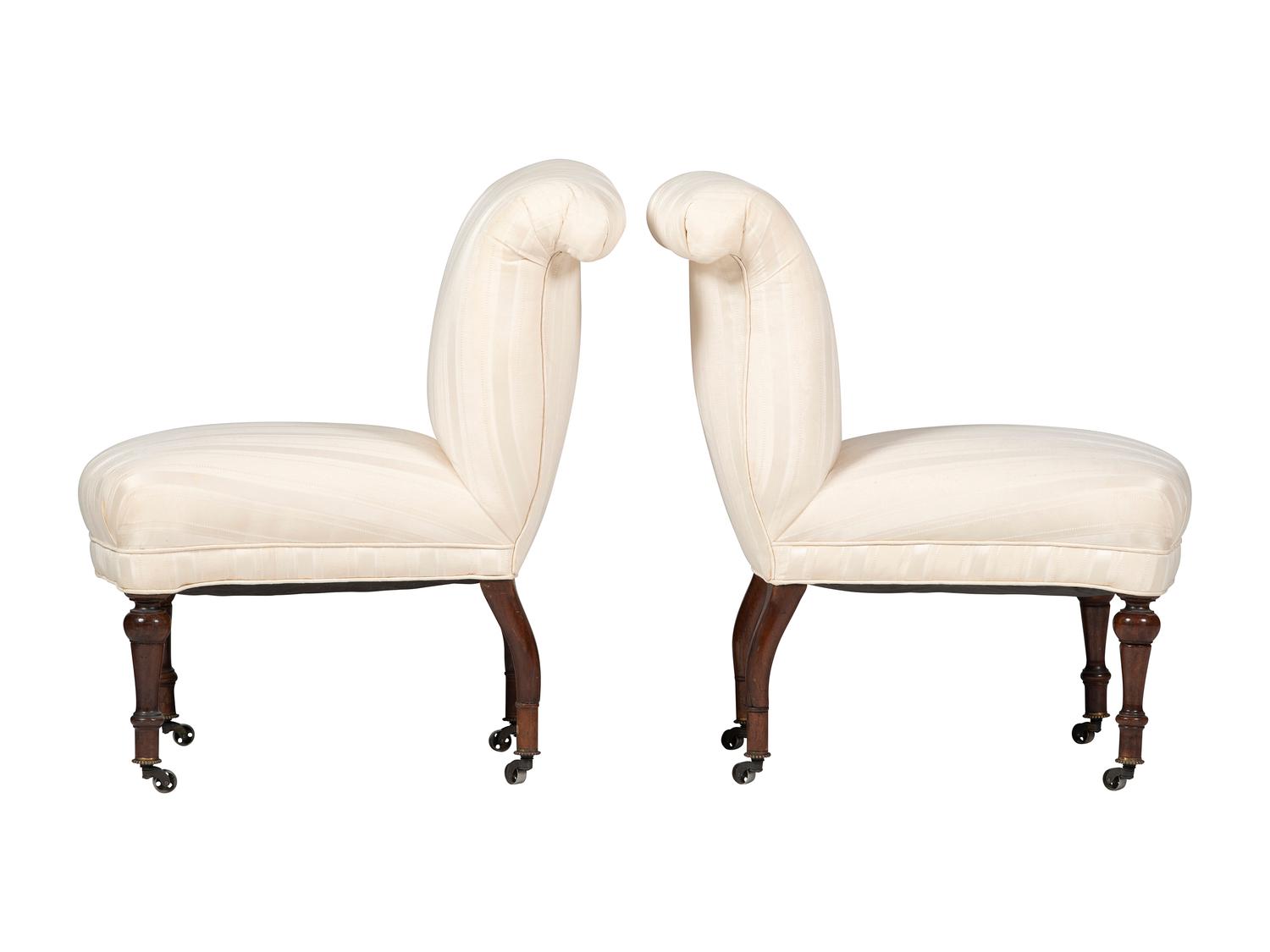 A Pair of Victorian Mahogany Roll Back Slipper Chairs