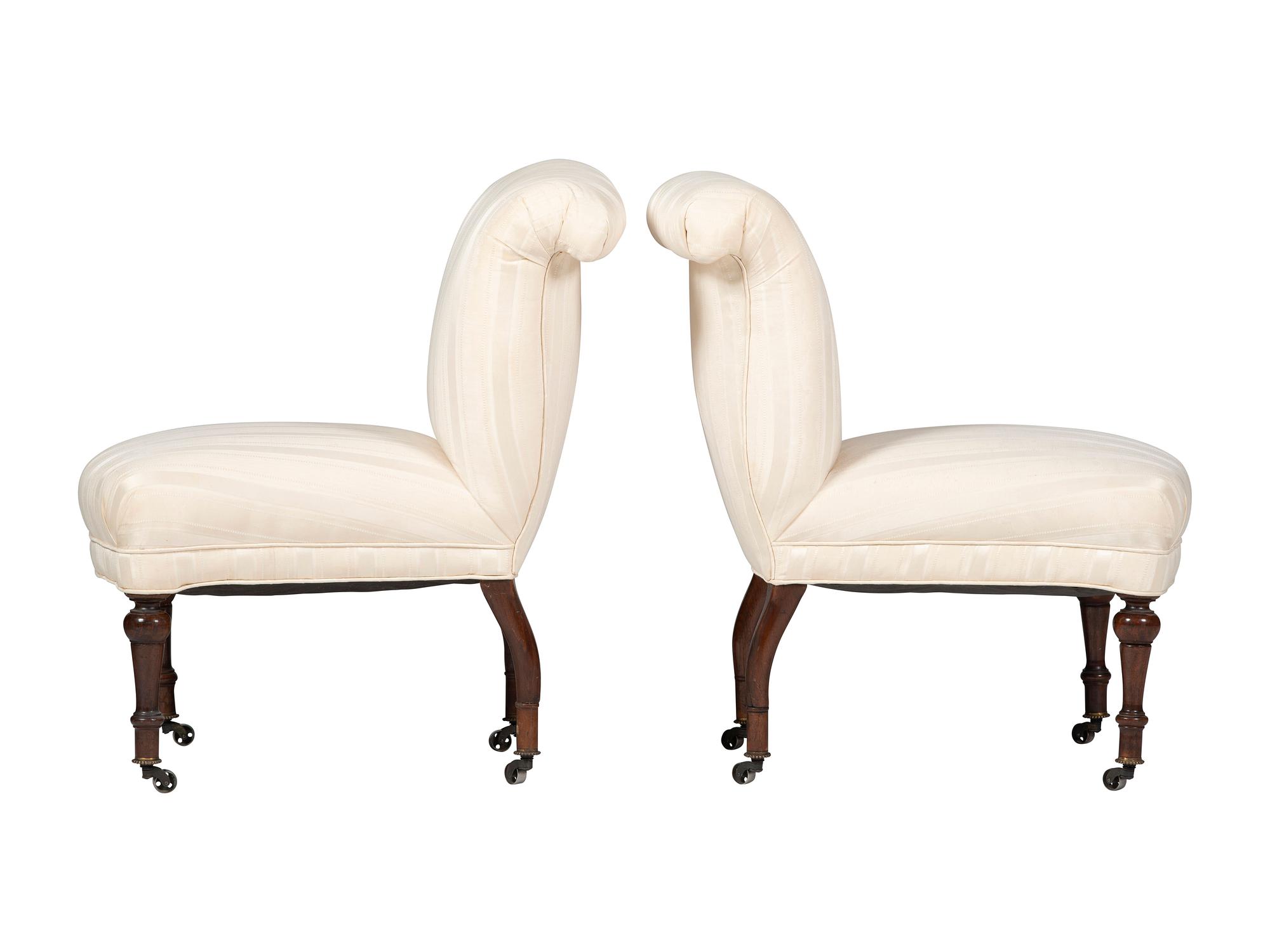 A Pair of Victorian Mahogany Roll Back Slipper Chairs