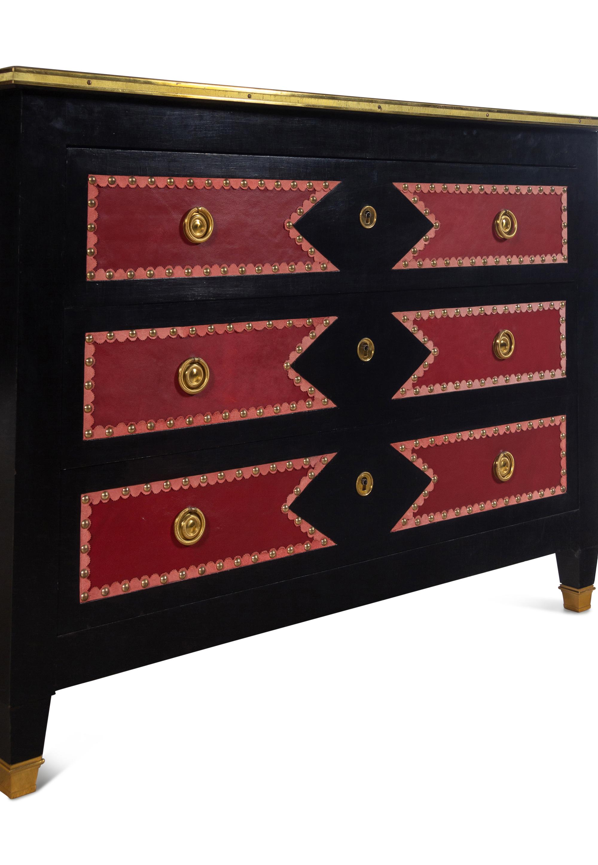A Black Painted Red Leather-Inset Chest of Drawers