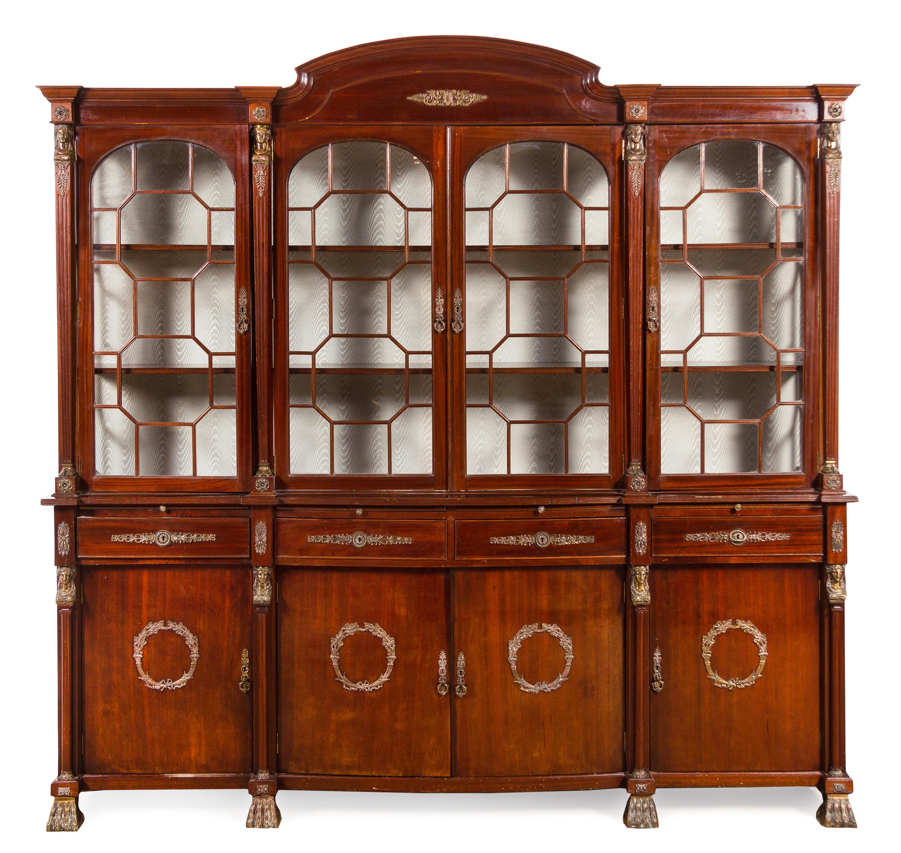 An Empire Style Gilt Metal Mounted Mahogany Breakfront Bookcase Height 88 x width 91 x depth 19 inches. — MID-20TH CENTURY