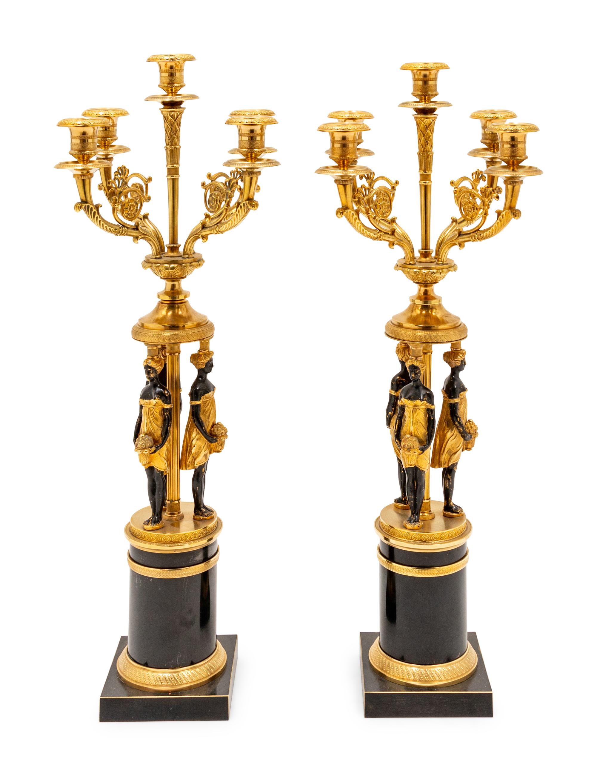 A Pair of Empire Style Gilt and Patinated Metal Figural Candelabra