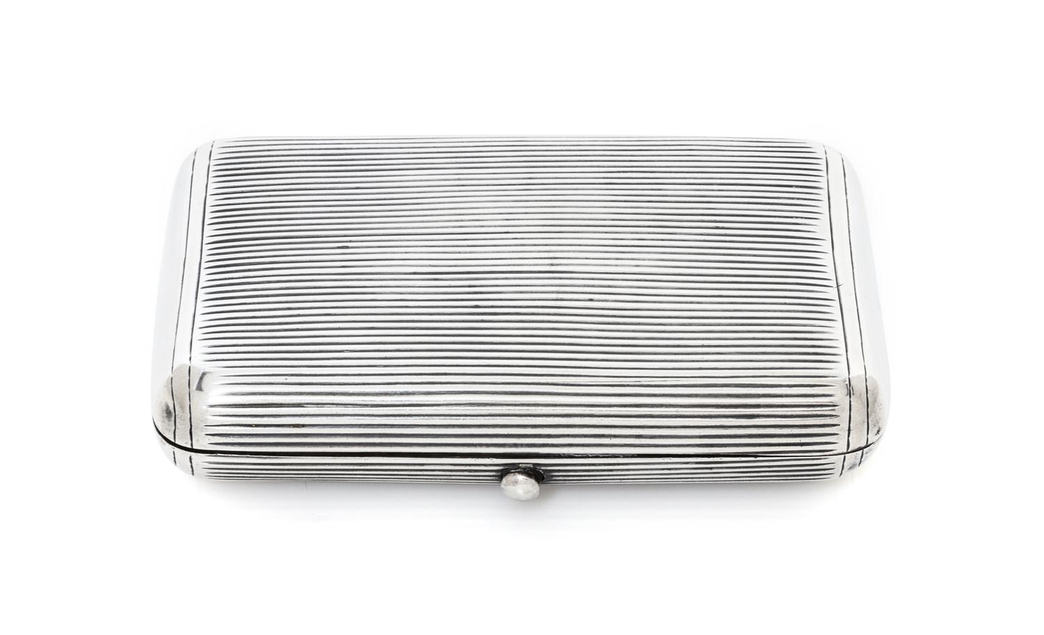 A Russian Silver Cigarette Case, Maker's mark AE, assay mark of Lev Oleks, Moscow, 1896, the lid and underside with reeded decoration.