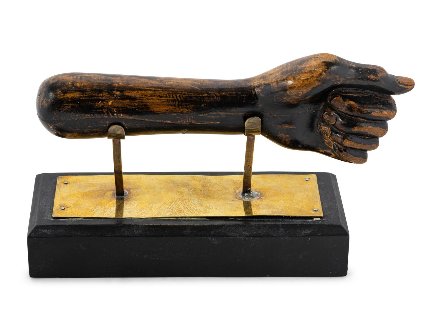 A Carved and Painted Clinched Fist