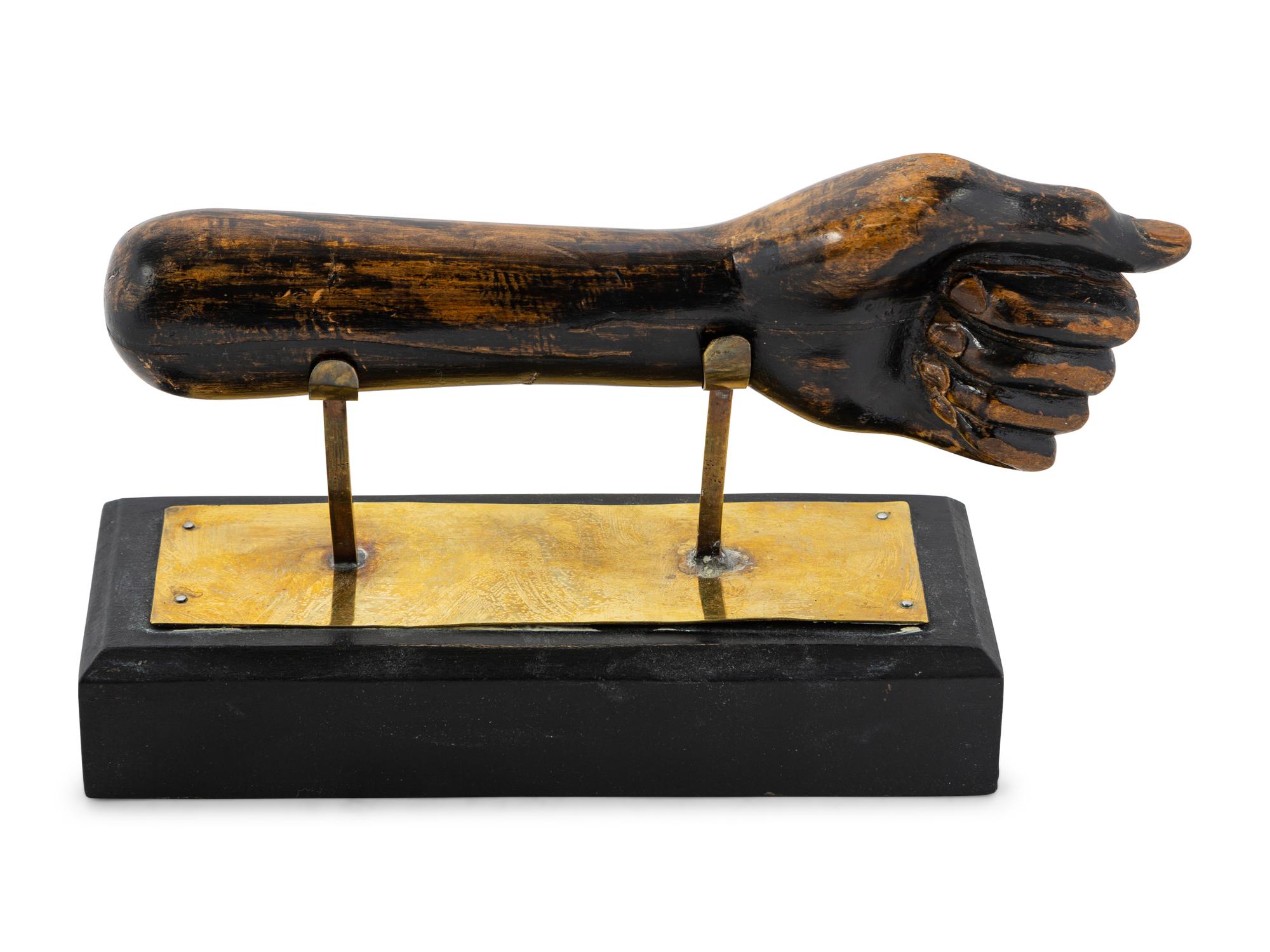 A Carved and Painted Clinched Fist