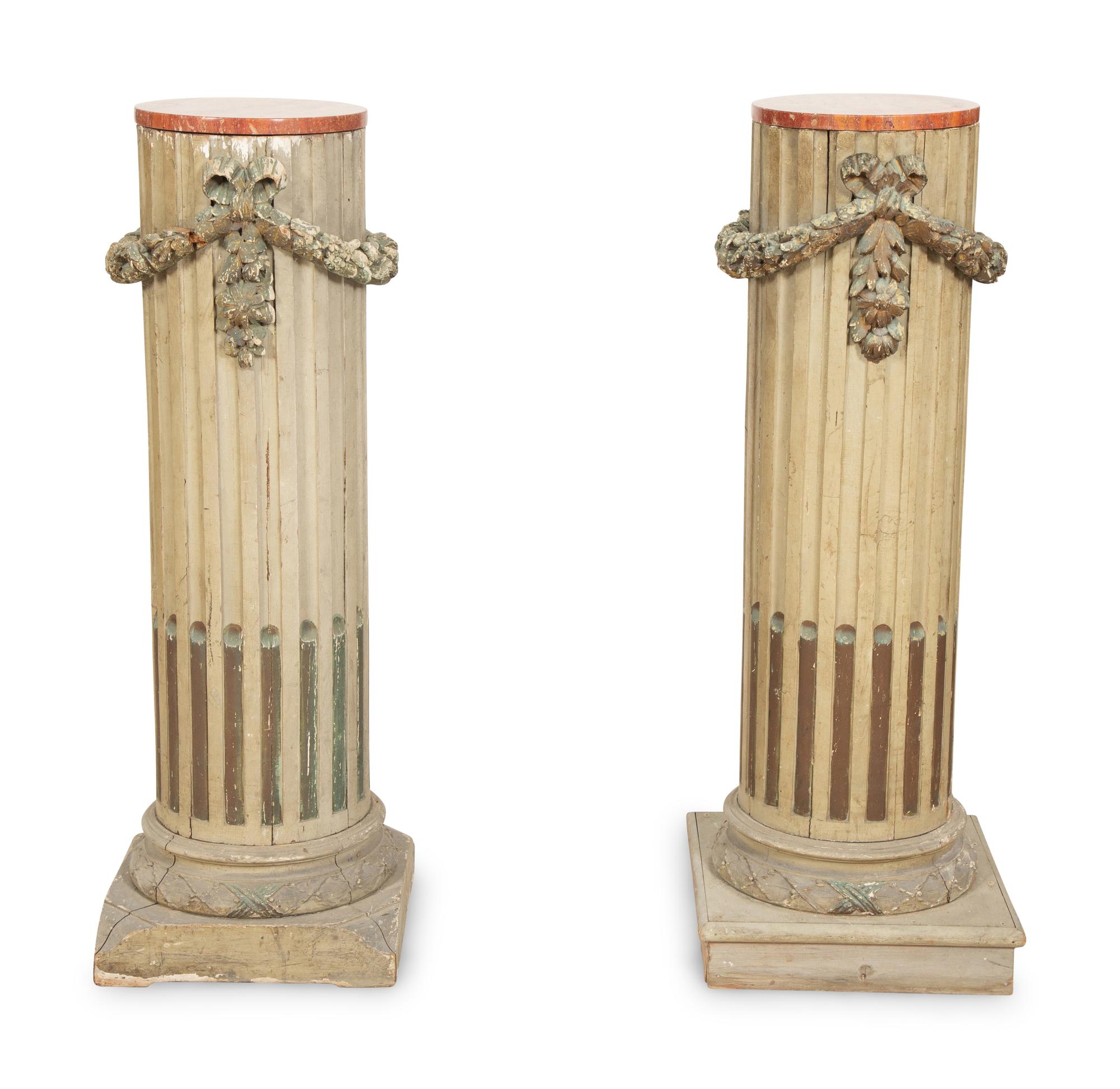 A Pair of Italian Carved and Painted Pedestals