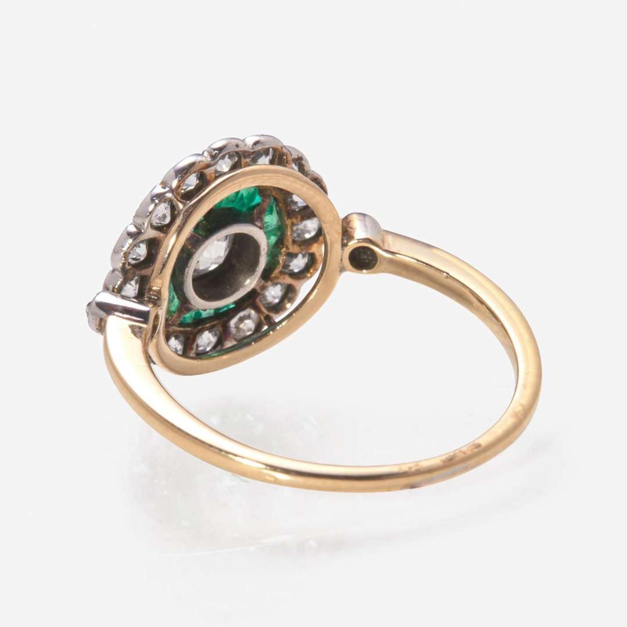 An Art Deco Gold, Diamond, and Emerald Ring