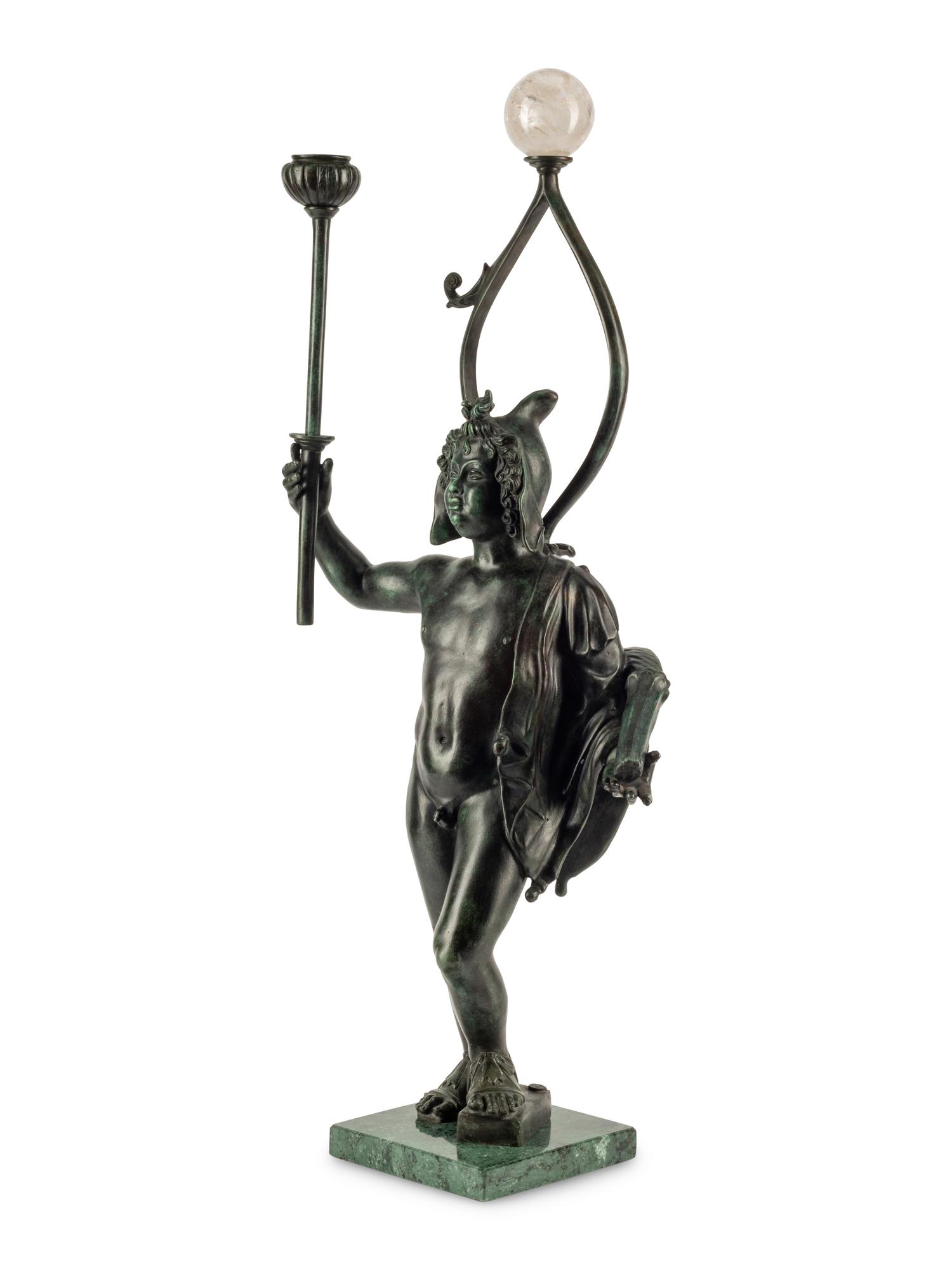 A Continental Patinated Bronze Figure with a Rock Crystal Ornament