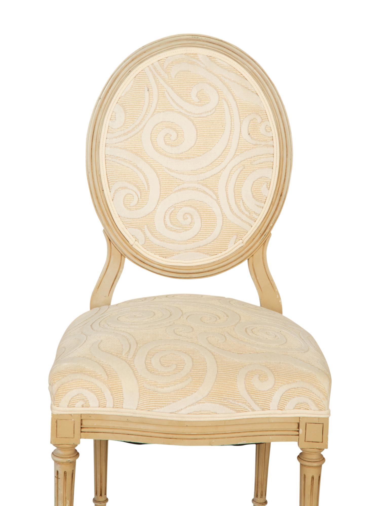 A Pair of Louis XVI Style Oval Back Painted Fauteuils and Matching Side Chair