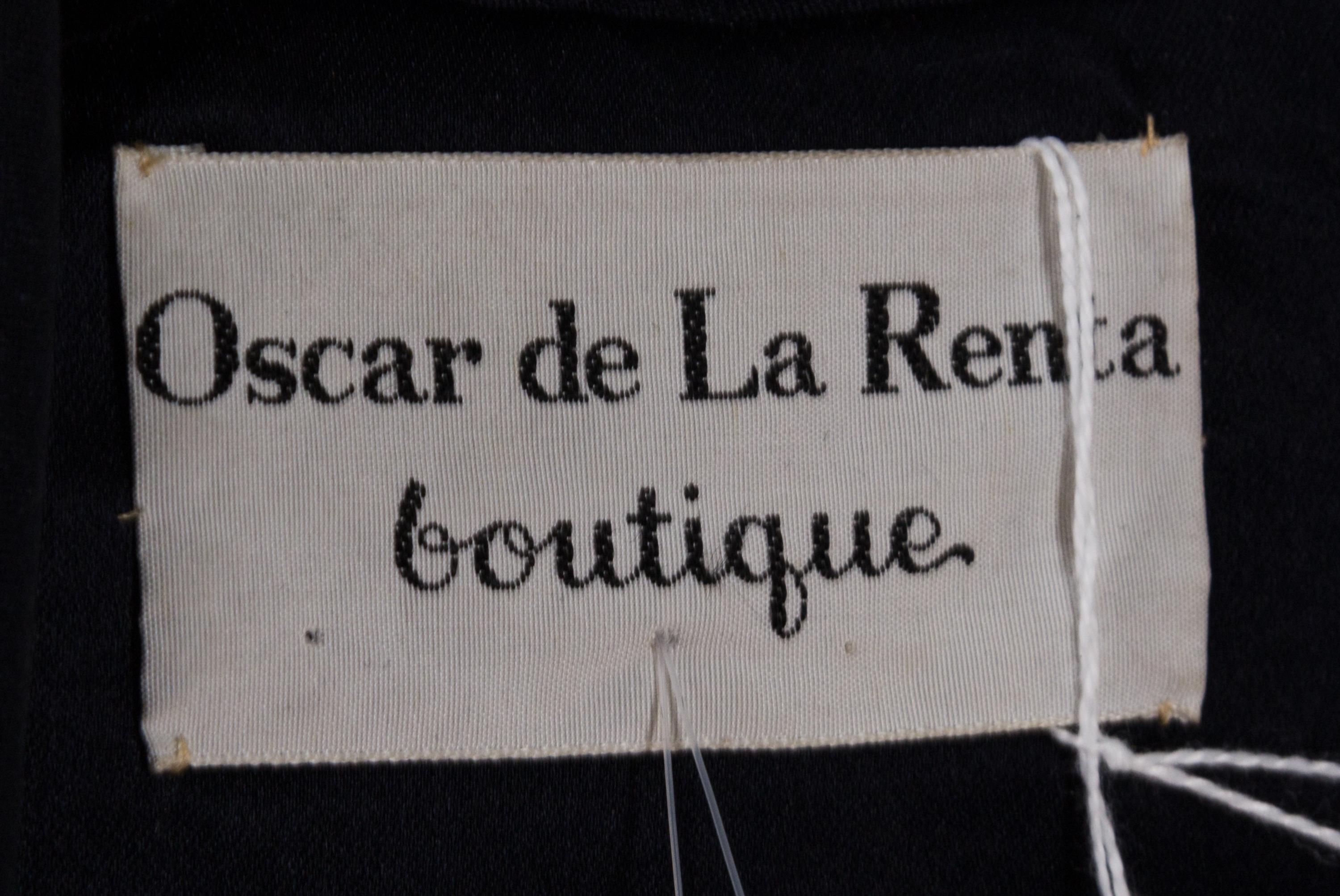 An Oscar de la Renta Black Silk Dress, Size 14.