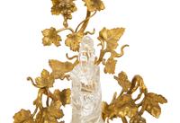 A Carved Rock Crystal Figure of Guanyin on a Grapevine Decorated Gilt Bronze Stand