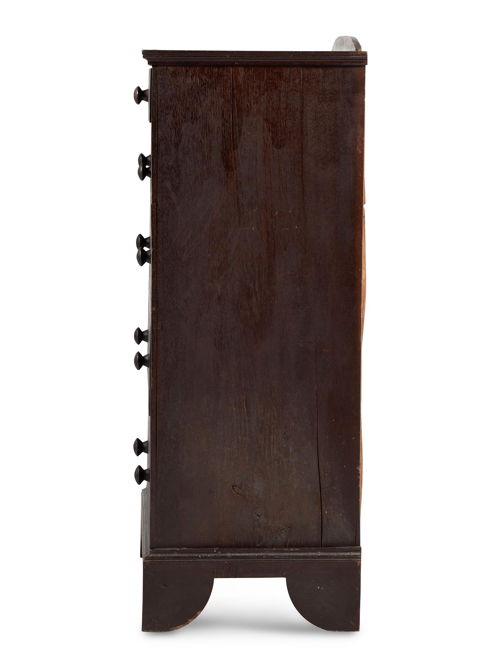A Country Chippendale Brown-Painted Walnut Five-Drawer Chest