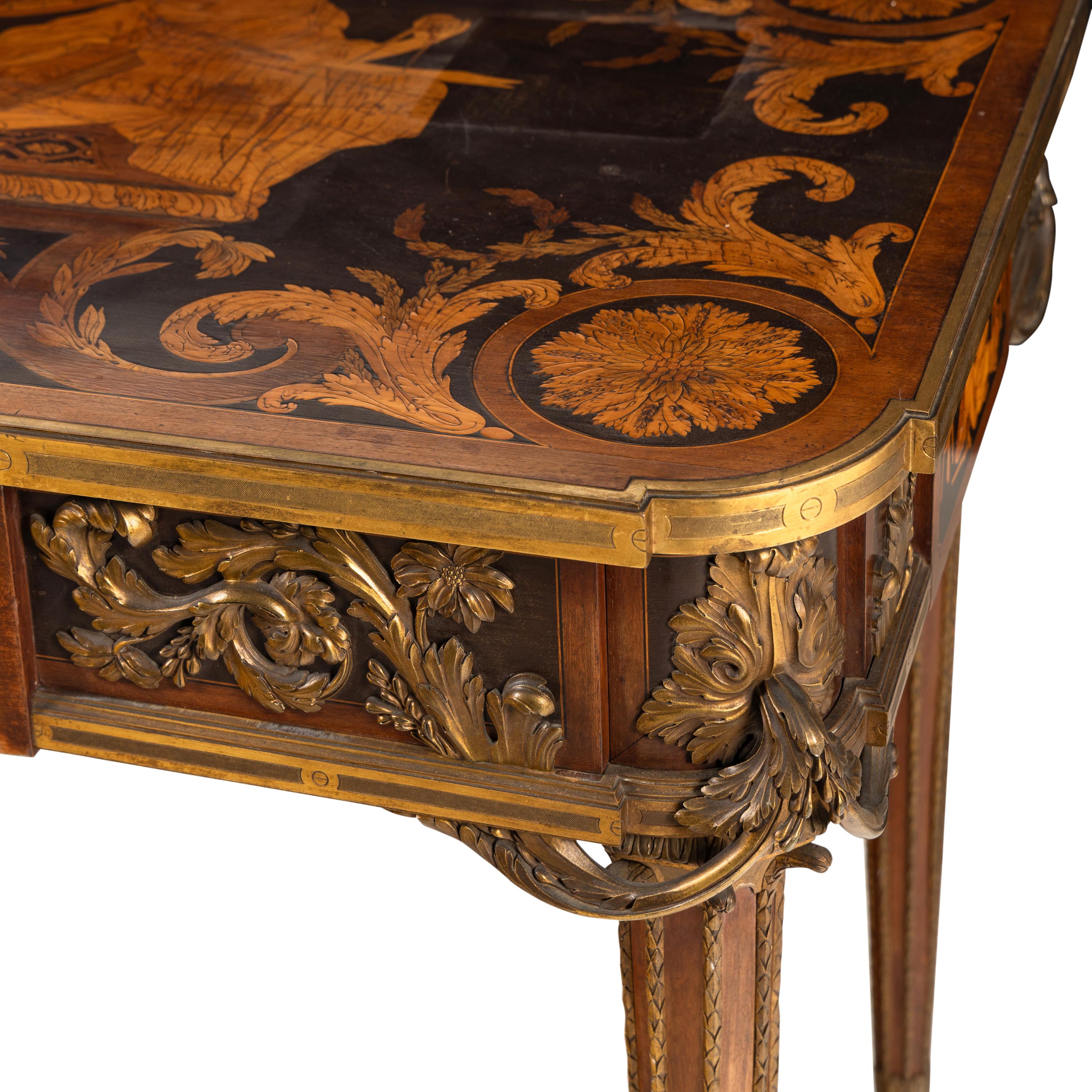 A Louis XVI Style Marquetry and Gilt Bronze Mounted Occasional Table