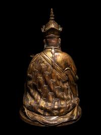 A Tibetan Gilt Bronze Figure of a Seated Guru