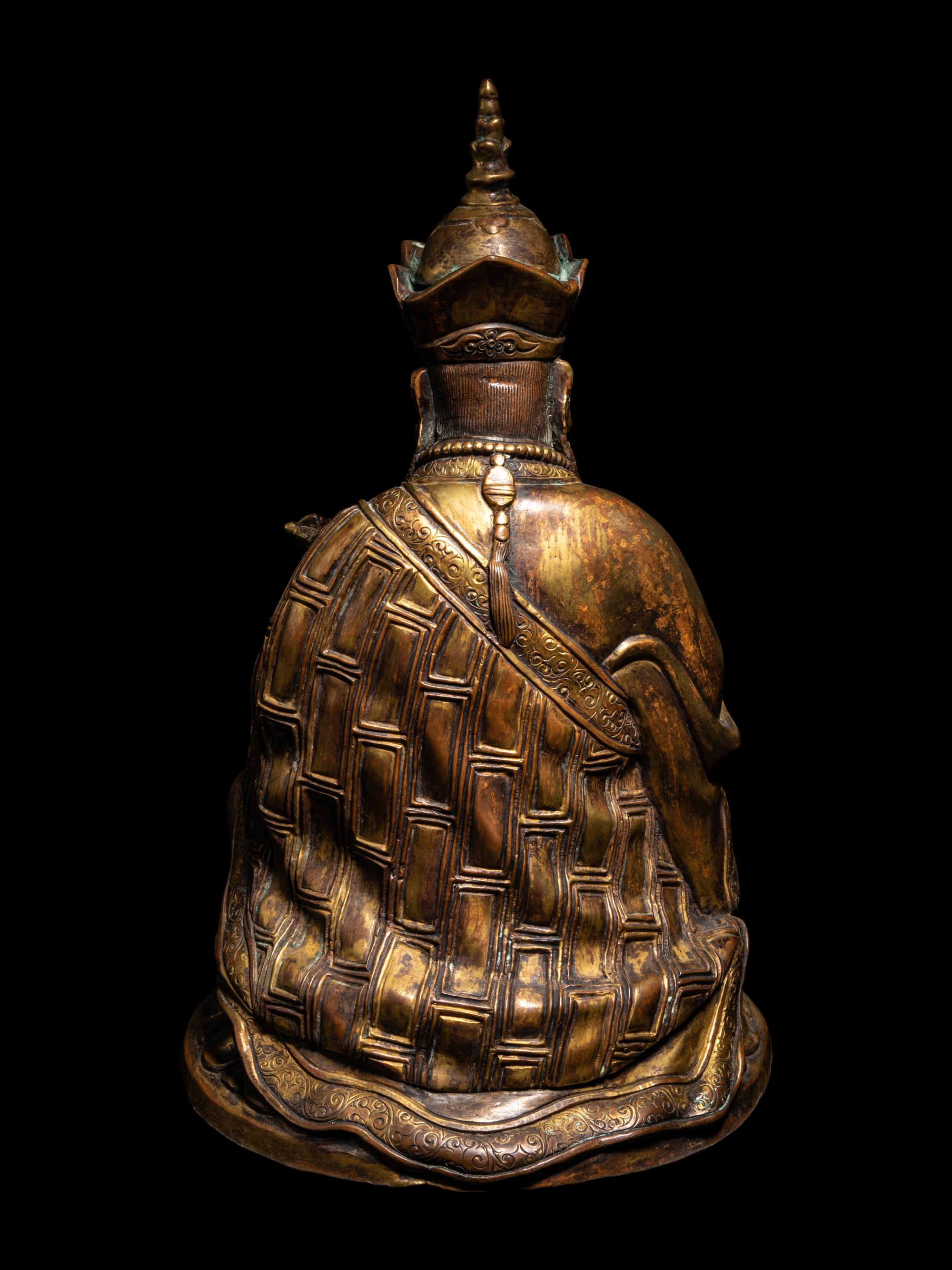 A Tibetan Gilt Bronze Figure of a Seated Guru