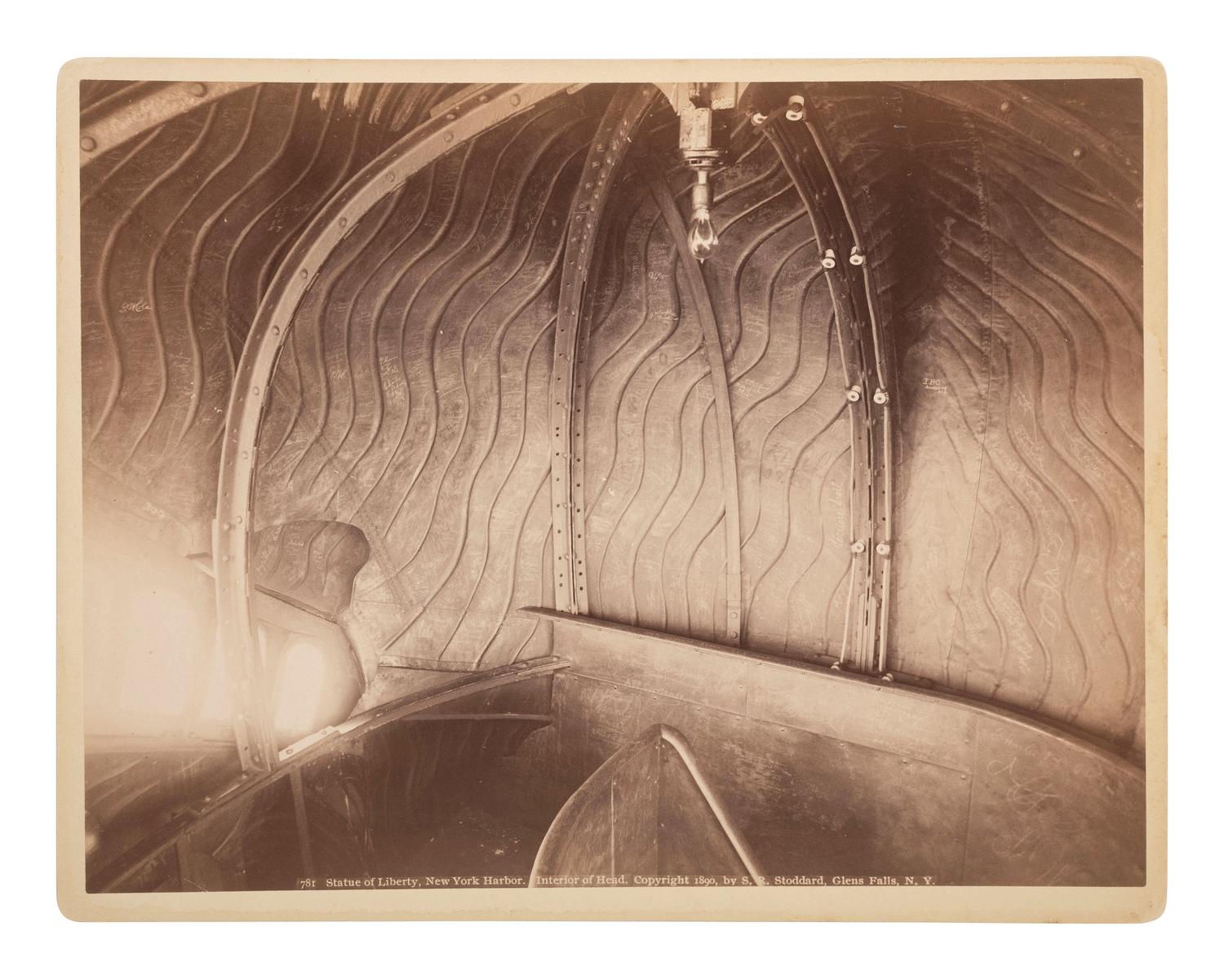 New York -- Statue of Liberty A pair of images related to the Statue of Liberty including an interior view of the head by Seneca Ray Stoddard (1844-1917).