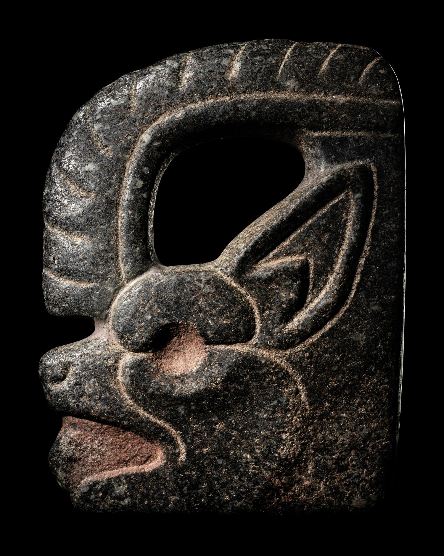 A Maya Stone Hacha in the Form of a Jaguar or Bat