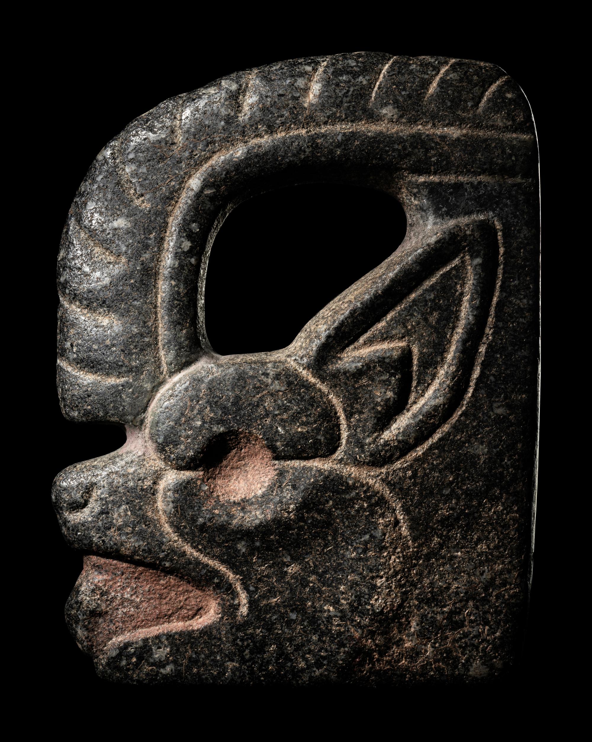 A Maya Stone Hacha in the Form of a Jaguar or Bat
