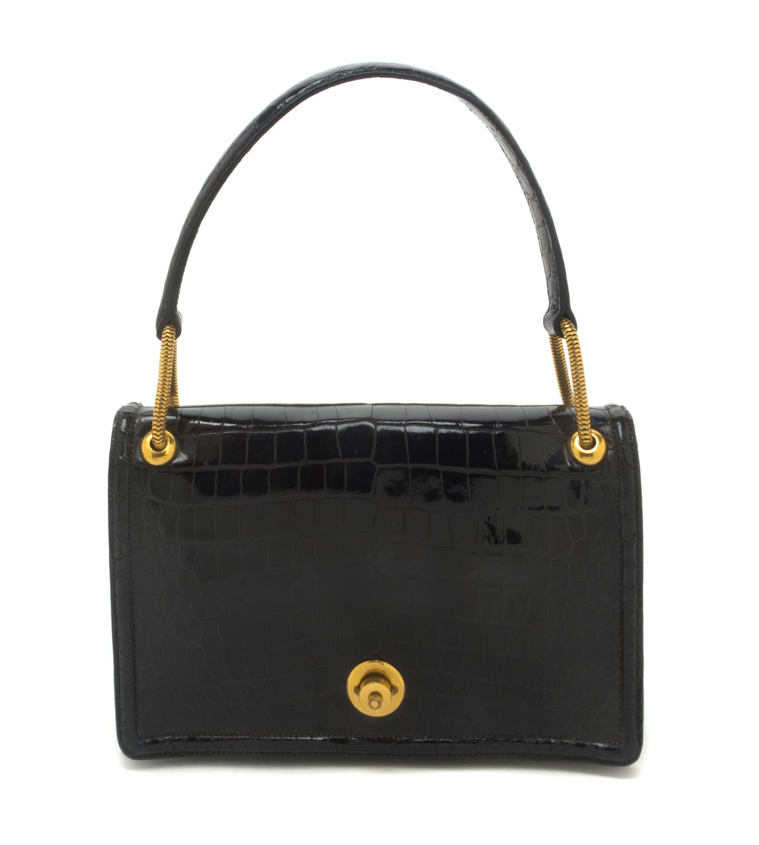 An Hermes Black Shiny Porosus Crocodile Piano Bag, 9 x 5 1/2 x 2 inches.