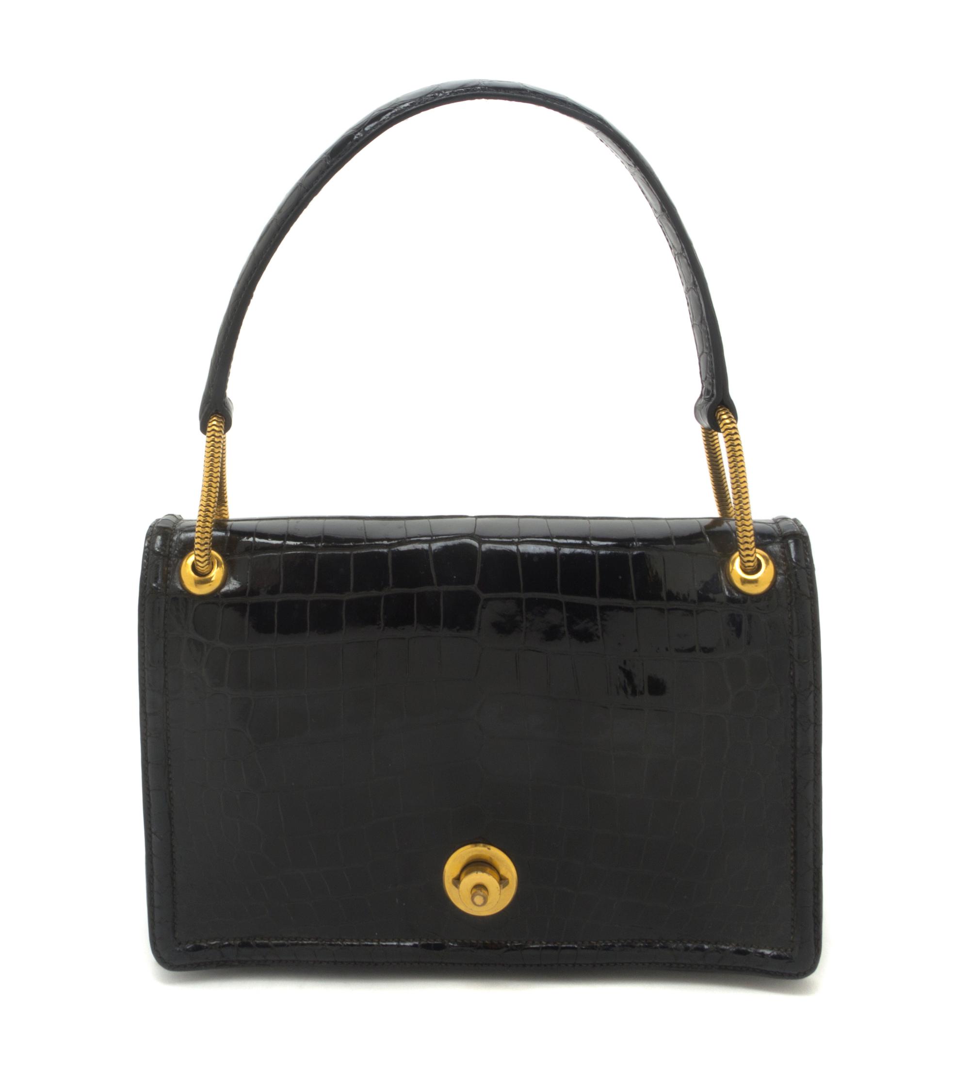 An Hermes Black Shiny Porosus Crocodile Piano Bag, 9 x 5 1/2 x 2 inches.
