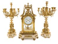 A Louis XVI Style Gilt Bronze and Marble Clock Garniture Height of candelabra 22 3/4 inches. — MOVEMENT BY A.D. MOUGIN, PARIS, LATE 19TH CENTURY