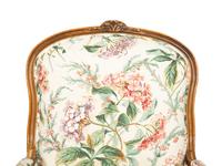 A Pair of Louis XV Style Walnut Bergères