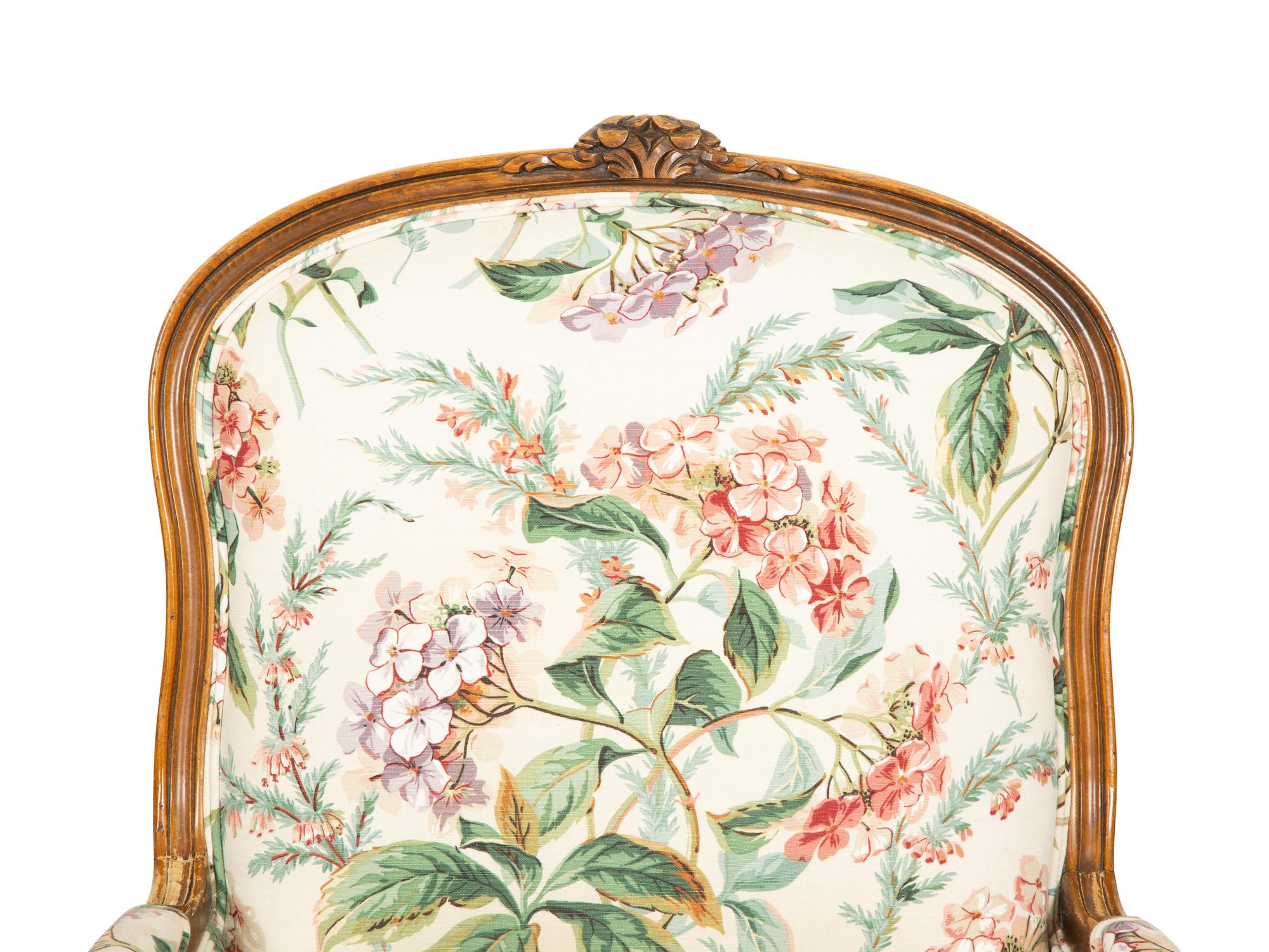 A Pair of Louis XV Style Walnut Bergères