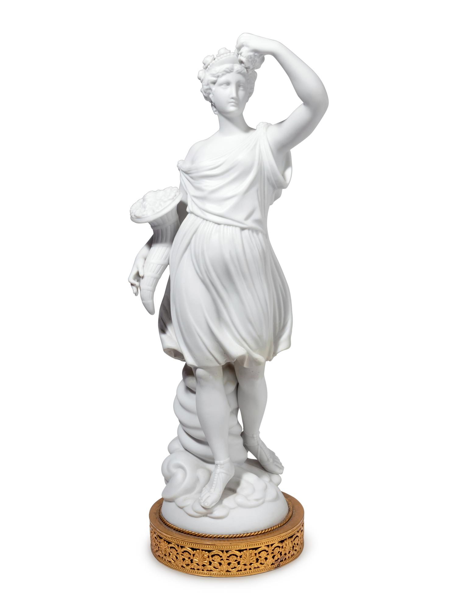 A Pair of Gilt Metal Mounted Bisque Porcelain Figures