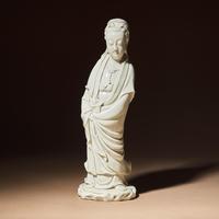 A Chinese Blanc-de-Chine Porcelain Standing Figure of Guanyin with 'He Chaozong' Mark, Qing Dynasty — 清 何朝宗款德化白瓷觀音立像