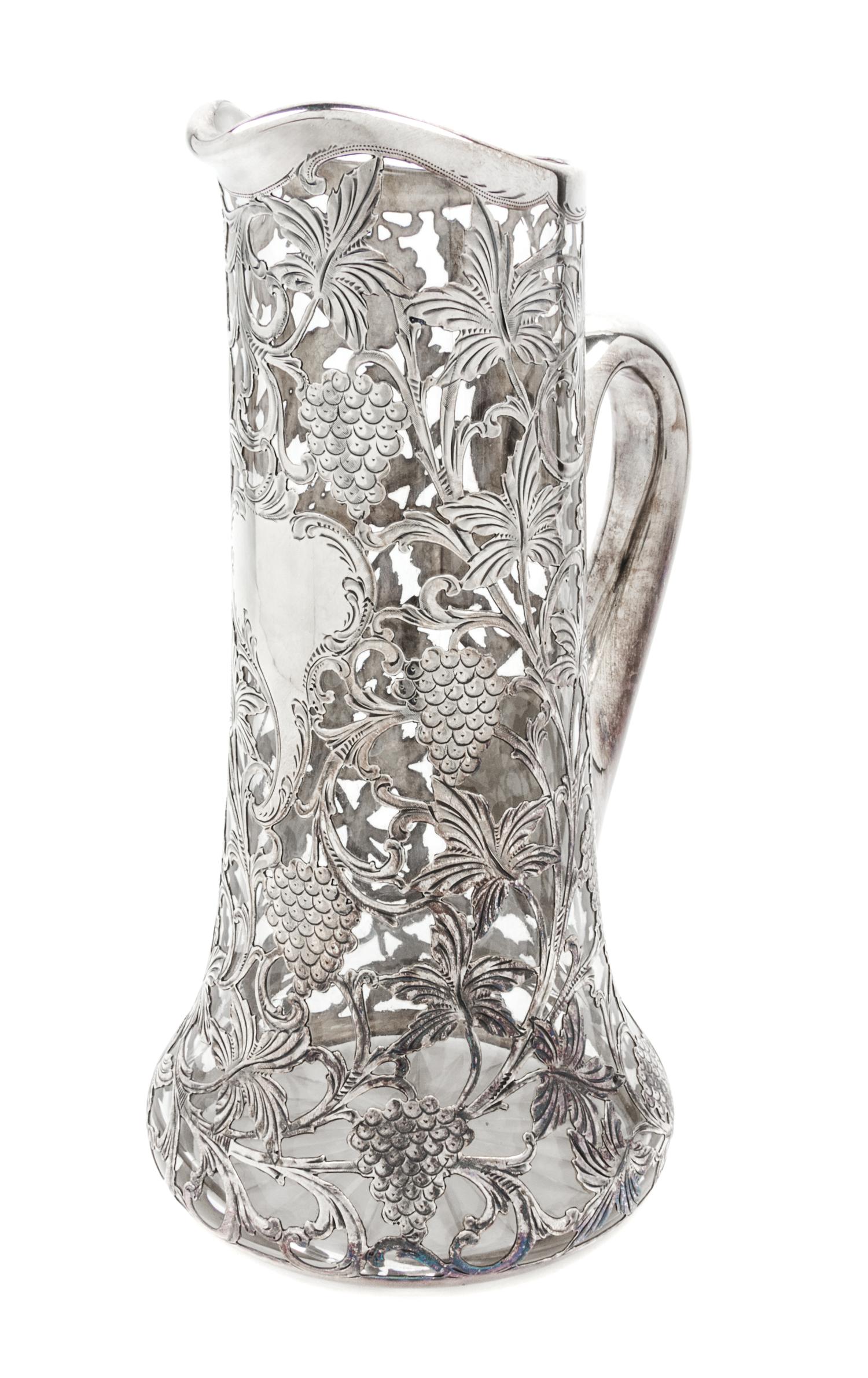A Silver Overlay Glass Pitcher Height 11 1/4 inches.