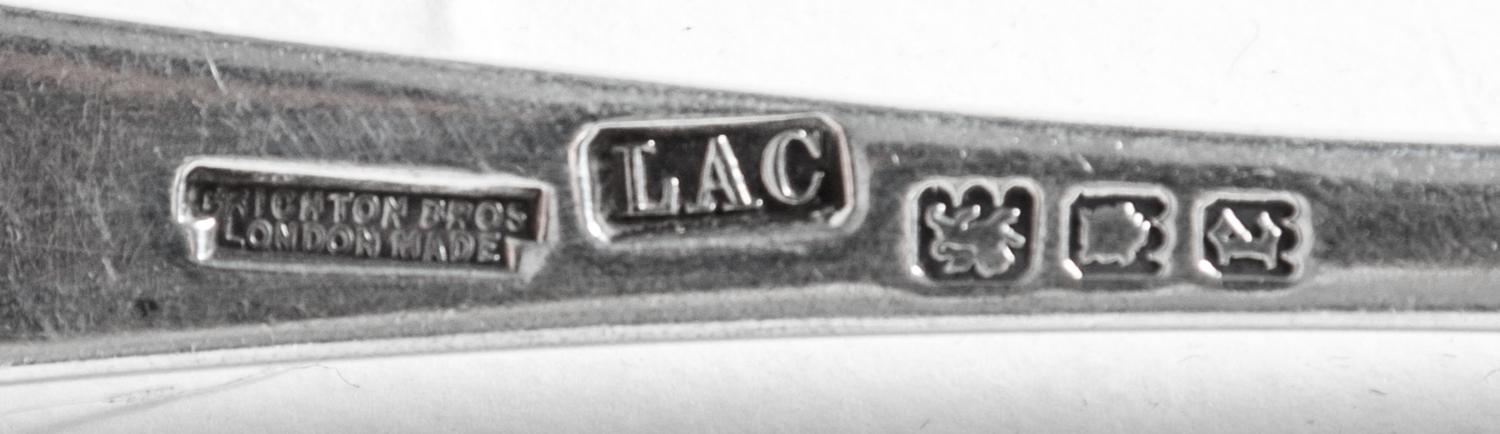 A Partial English Silver Flatware Service, Crichton Bros, 20th Century, comprising: 12 dinner knives 2 luncheon knives 9 dinner forks 1
