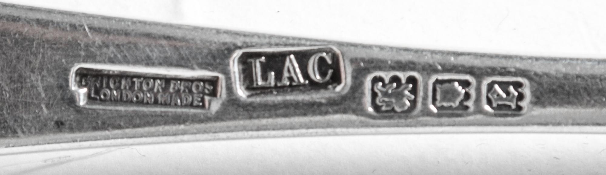 A Partial English Silver Flatware Service, Crichton Bros, 20th Century, comprising: 12 dinner knives 2 luncheon knives 9 dinner forks 1