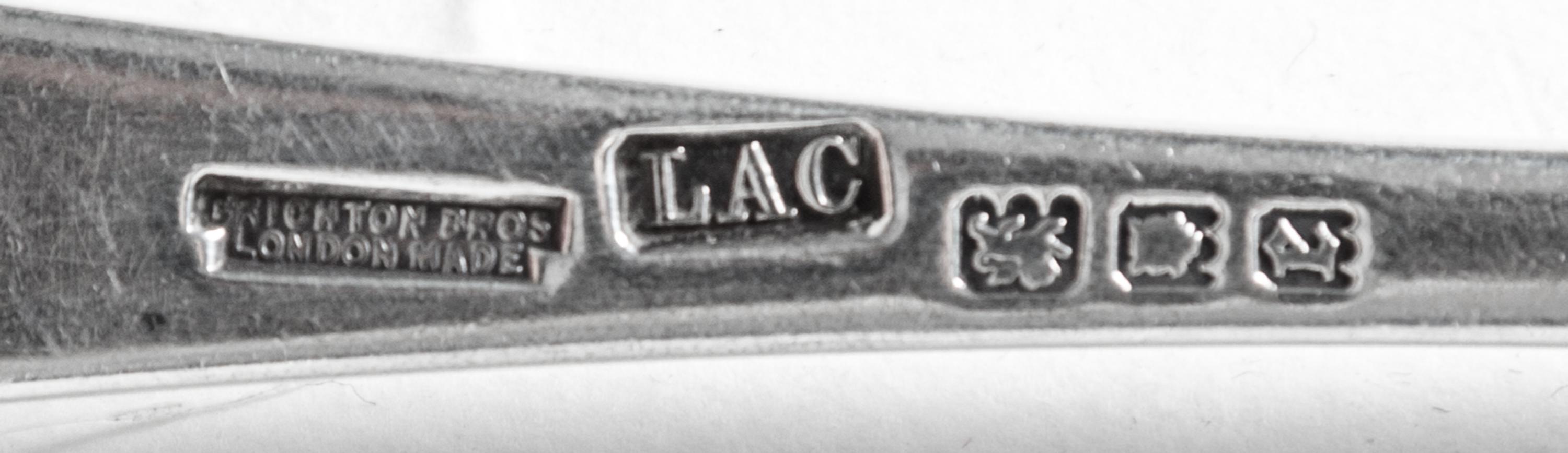 A Partial English Silver Flatware Service, Crichton Bros, 20th Century, comprising: 12 dinner knives 2 luncheon knives 9 dinner forks 1