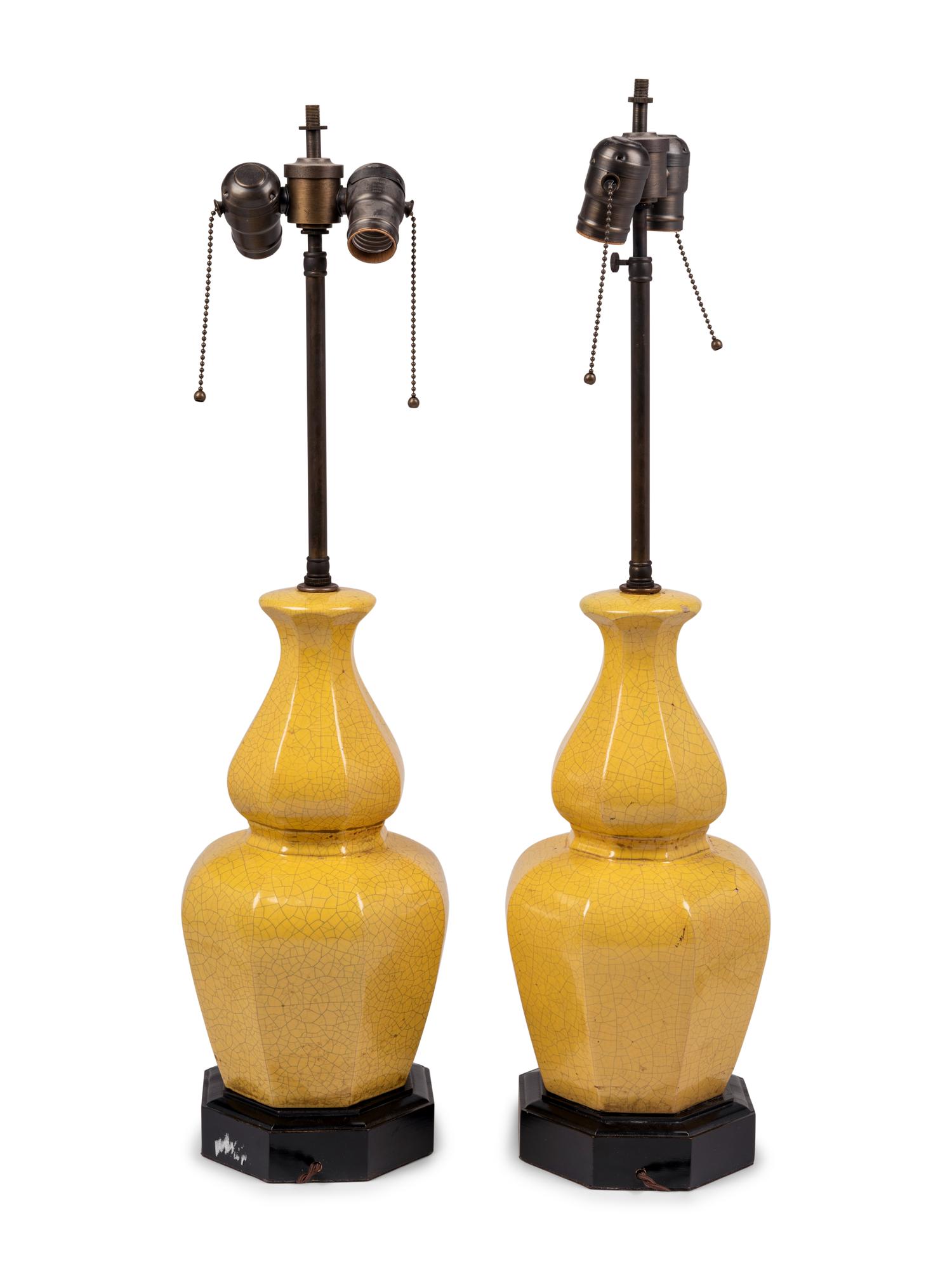 A Pair of Yellow Glazed Pottery Lamps