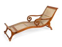 A British Colonial Caned Teak Chaise Longue — 19TH CENTURY