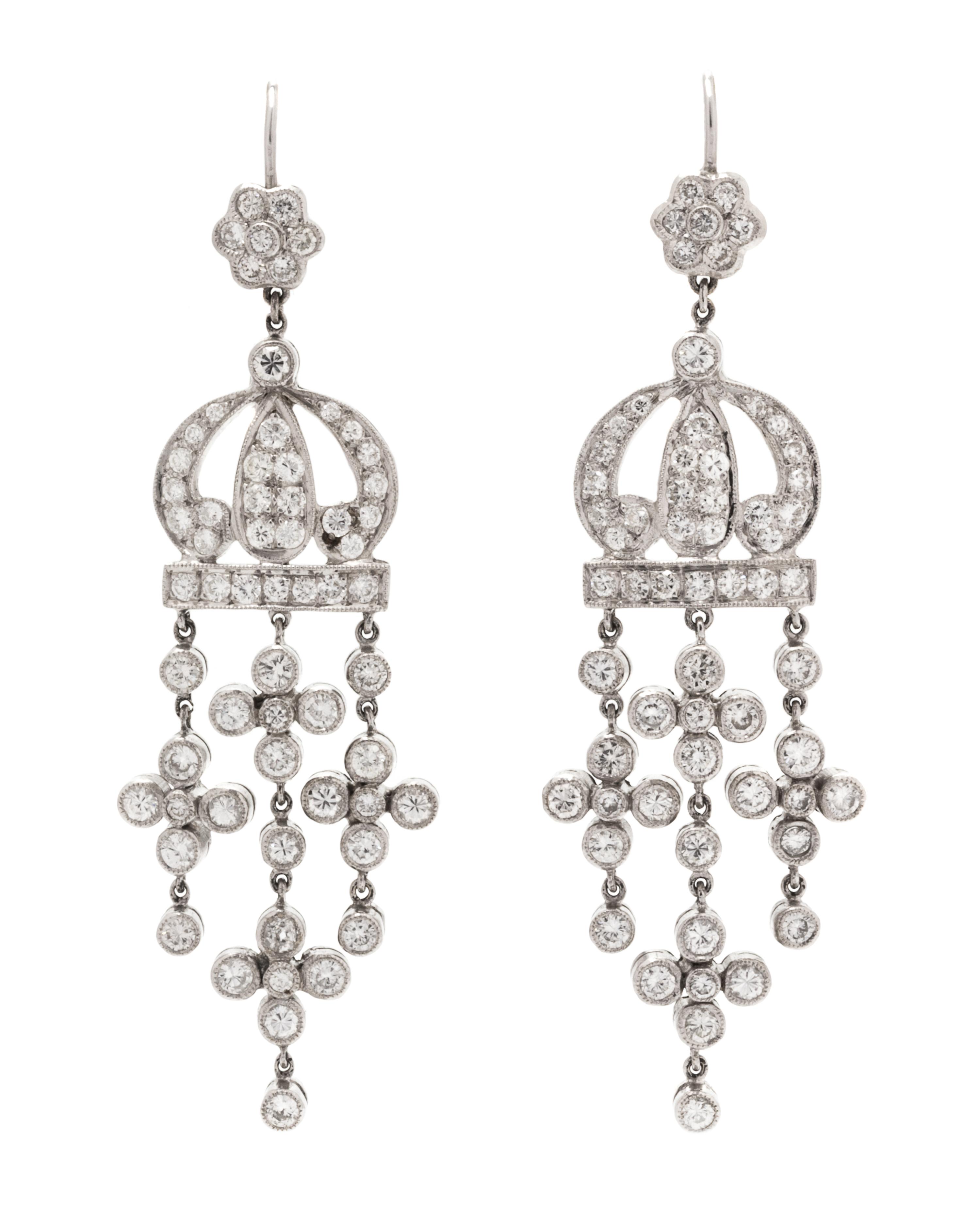 A Pair of 18 Karat Gold and Diamond Dangle Earrings, 7.50 dwts.