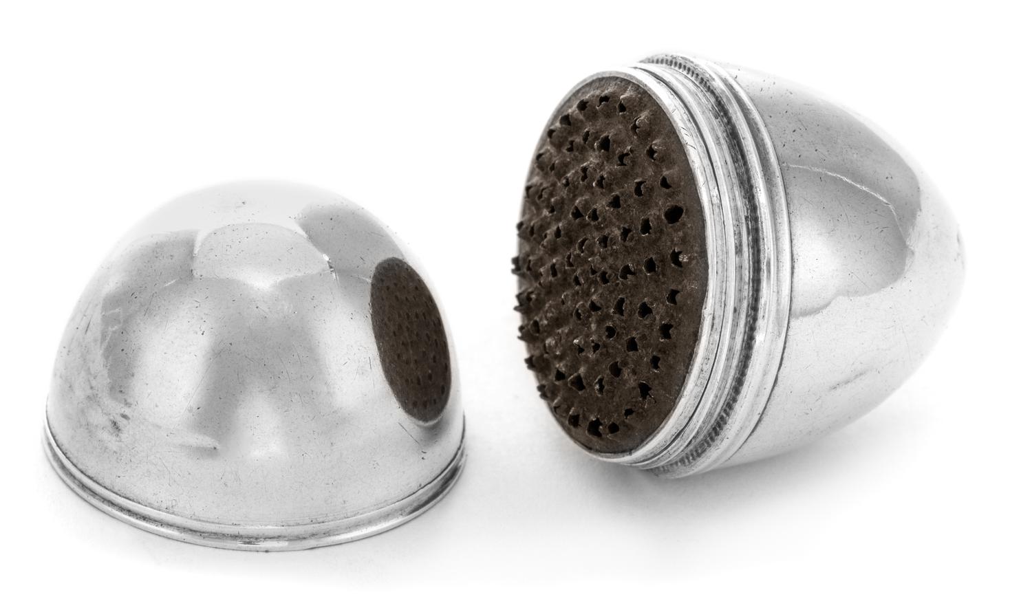 A George III Silver Nutmeg Grater, , of ovoid form with a reeded band, opening to a grater.