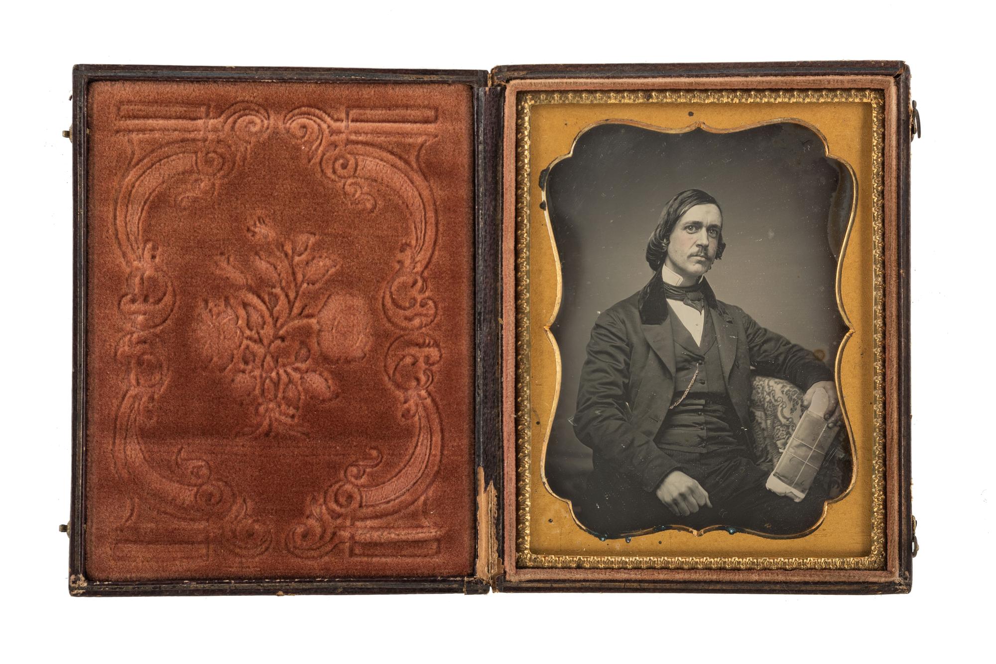 [EARLY PHOTOGRAPHY]. A group of 2 occupational daguerreotypes, incl. a lawyer and possible carpenter with his family.