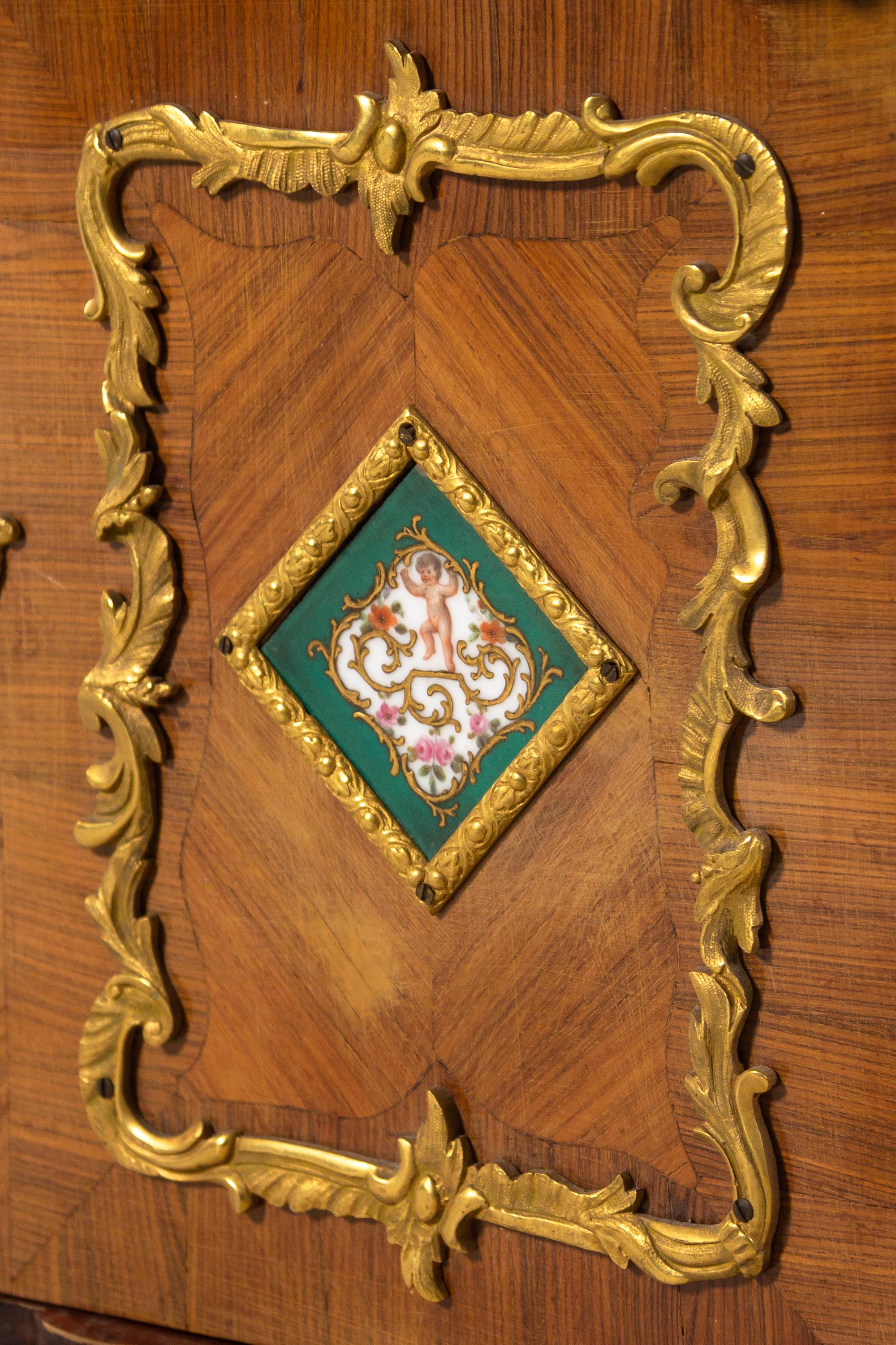 A Louis XV Style Porcelain and Bronze Mounted Tulipwood Veneered Hanging Étagère