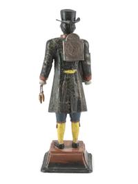 A Painted Cast-Iron 'Clock Peddler' Figural Desk Clock