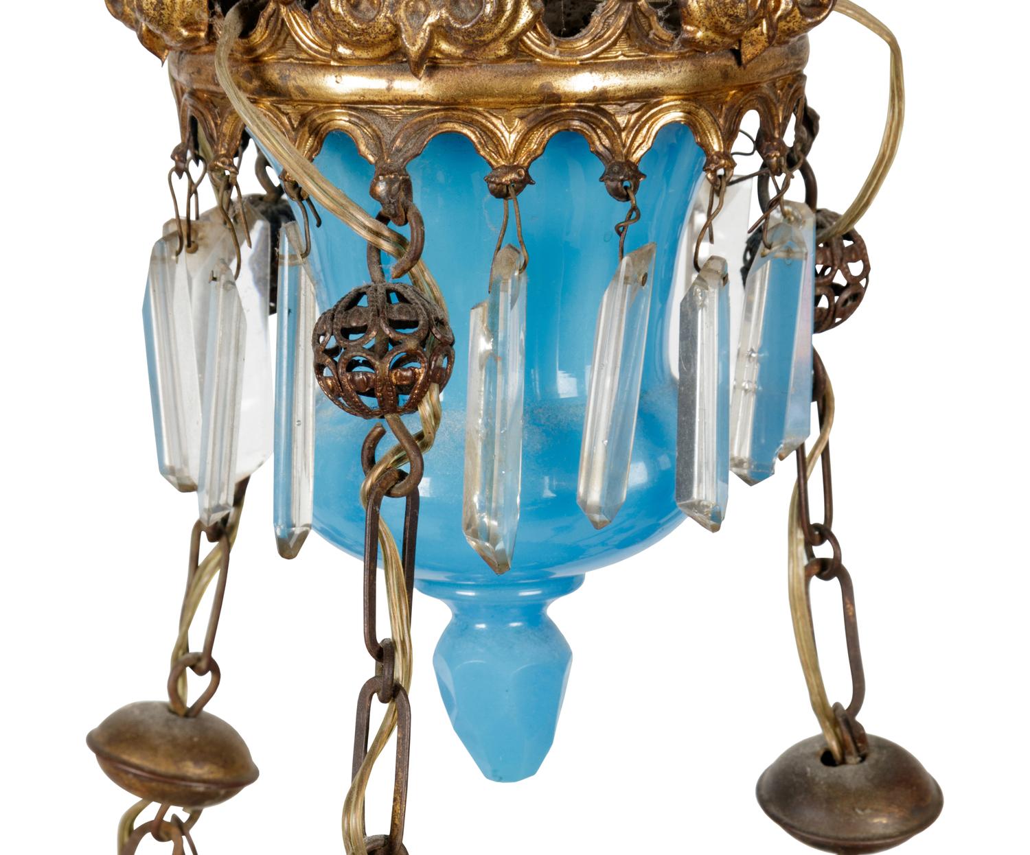 A Gilt Metal Mounted Opaline Glass Six-Light Chandelier