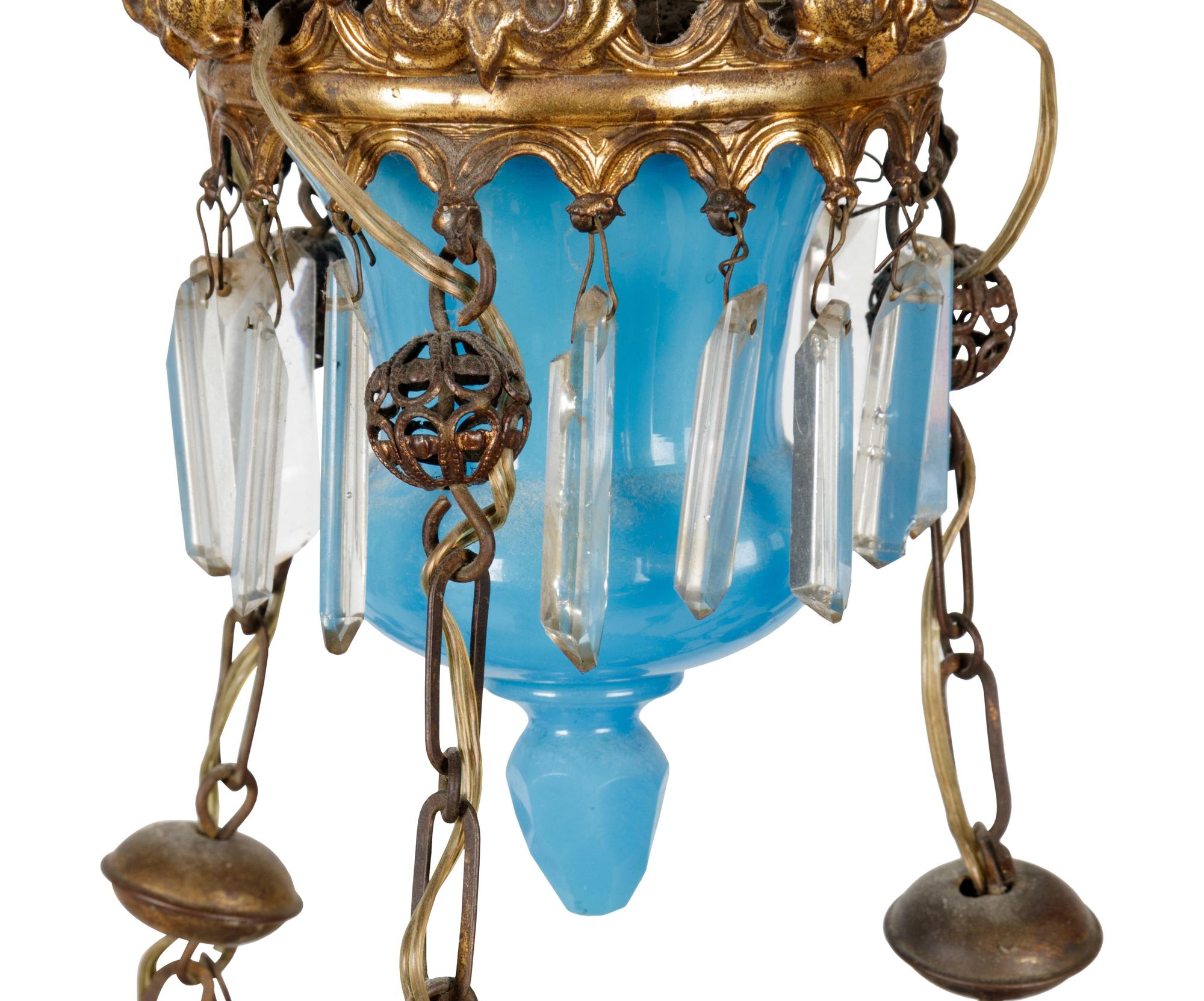 A Gilt Metal Mounted Opaline Glass Six-Light Chandelier