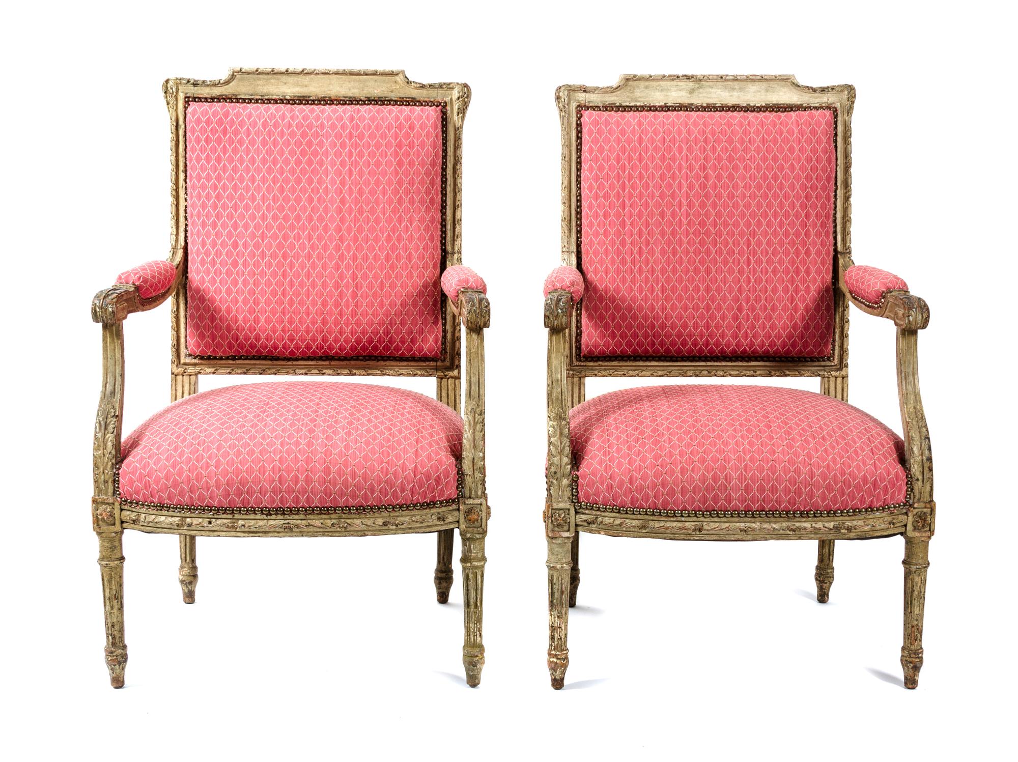 A Pair of Louis XVI Style Carved and Painted Fauteuils Height 38 1/2 x width 24 x depth 21 inches. — 19TH CENTURY