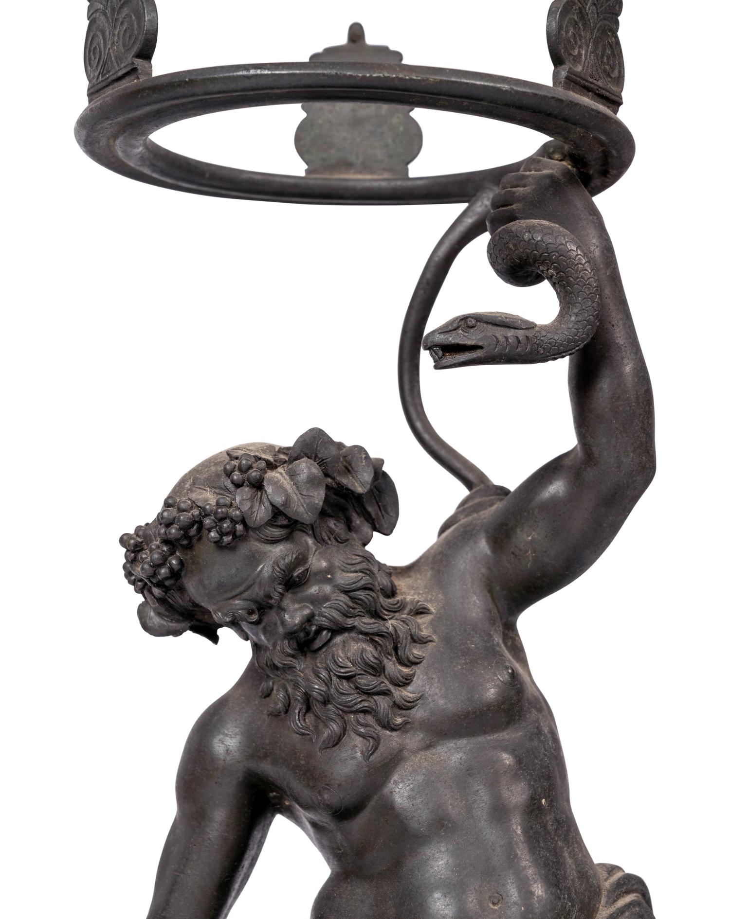 A Grand Tour Bronze Figure of Silenus Wrestling a Serpent