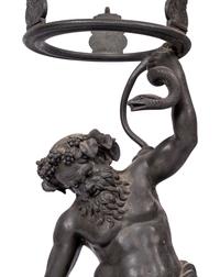 A Grand Tour Bronze Figure of Silenus Wrestling a Serpent